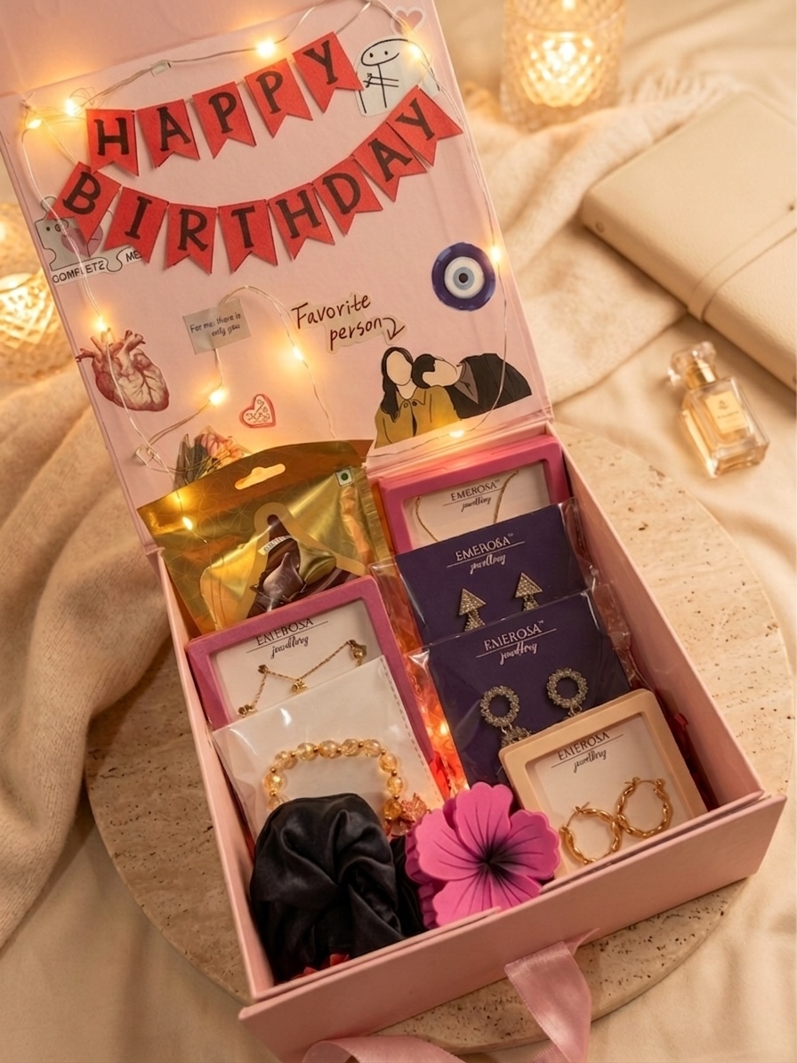Gift box with jewelry and decorative items on a soft surface