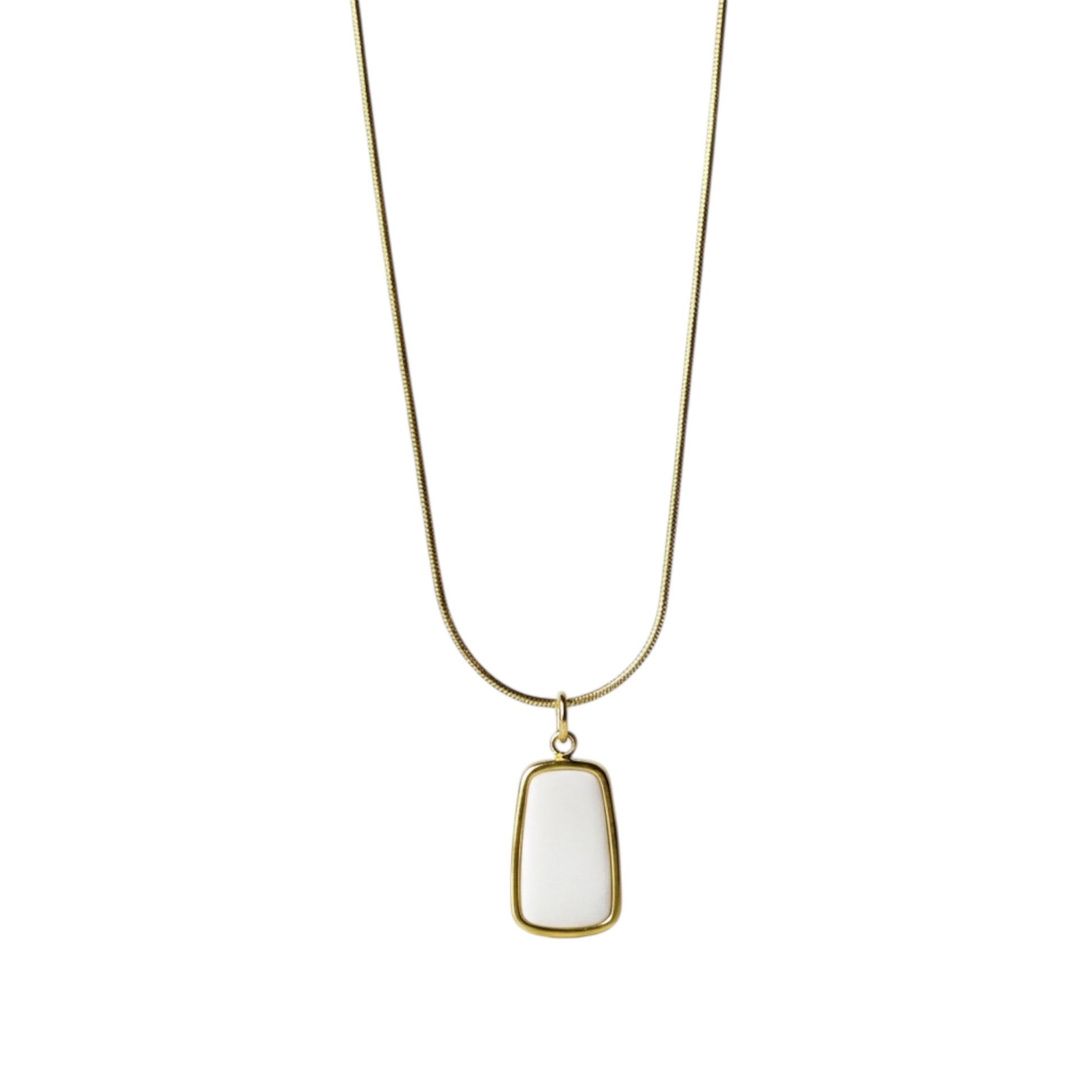 Necklace with a white pendant and gold chain on a white background